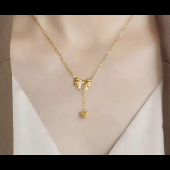 Bow Pendant Necklace with a Heart