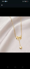 Bow Pendant Necklace with a Heart